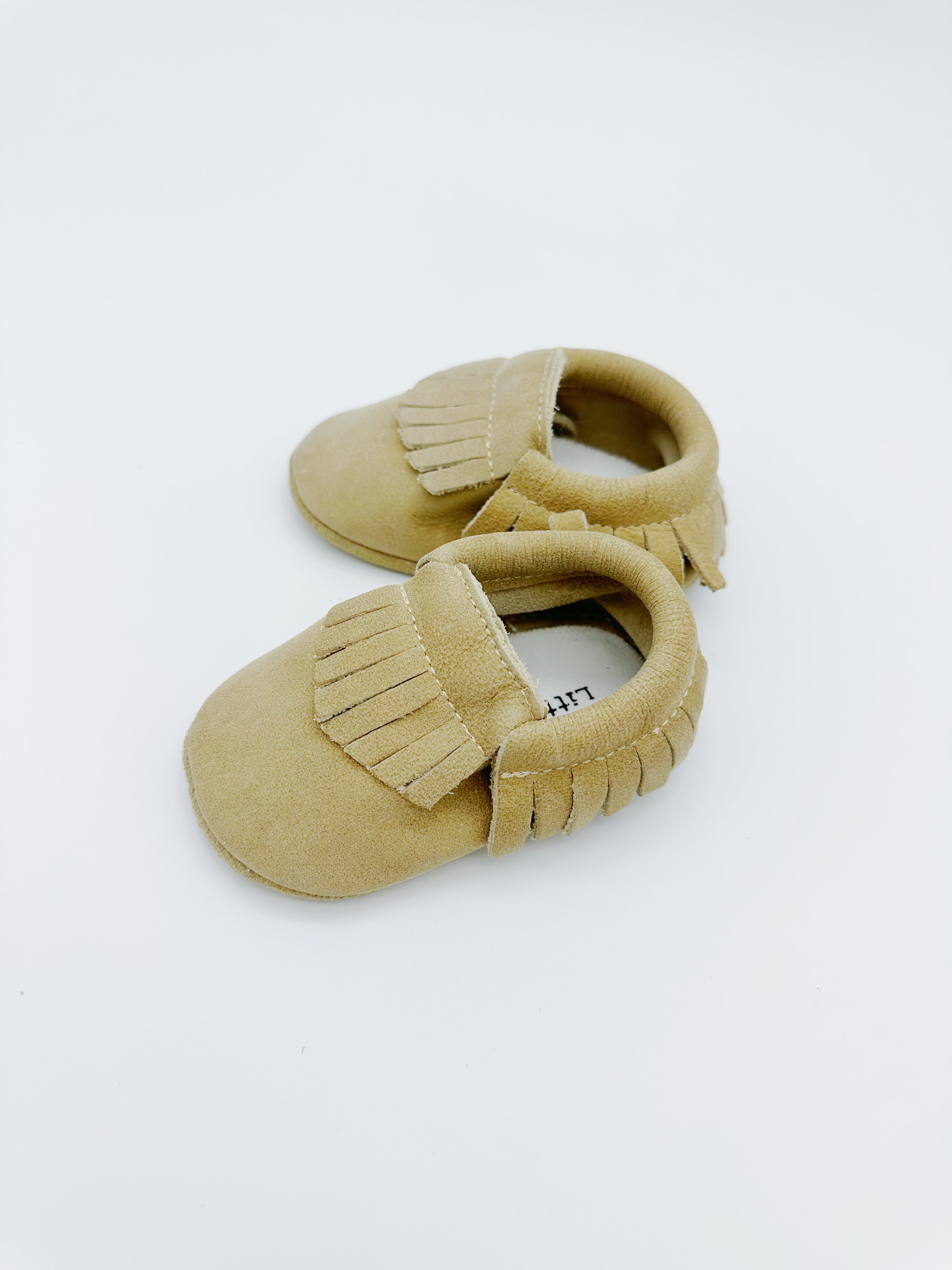 Fringe Beige Baby Leather Flat Shoes